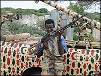 Islamic fighter in front of battlewagon